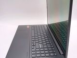 a laptop that is open on a white surface