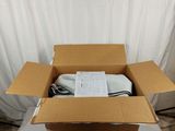a cardboard box with a computer in it on a table
