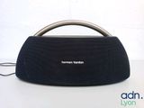 the harmman klipon portable bluetooth speaker is sitting on a table