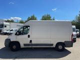 the white van is parked in a parking lot with other vehicles