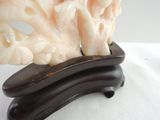 a sculpture of some sort on a stand on a white surface