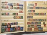an open book with a lot of stamps on it