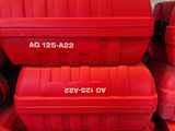 many red suitcases stacked on top of each other