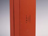 a red box that is open and sitting on a white surface