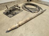 cement floor with tools on top of it in a room
