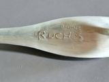 a spoon that has a name on it on it