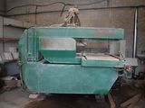 a green machine that is sitting in a room