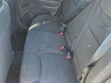 the back seats of a car with a seat belt in a car