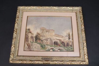 une vieille photo représentant un bâtiment, dans un cadre doré