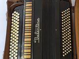 an image of an accordion sitting in a box on a table
