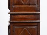 pair of antique wooden cabinets on casteors on a parquet floor