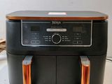 a black and orange air fryer sitting on a counter