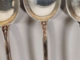 three spoons that are sitting next to each other