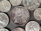 a lot of coins that are on the table