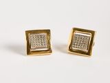 a pair of gold and diamond earrings