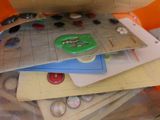a pile of papers and buttons on top of each other
