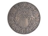 an image of a silver coin with a coat of arms on it