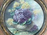 a picture of a painting of purple and yellow flowers in a vase