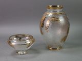 two vases that are sitting next to each other on a table