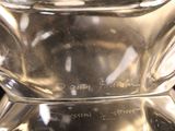 a close up of a glass vase on a table