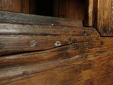 a close up of a wooden door with a wooden handle