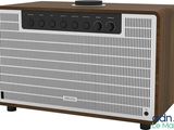 an image of a brown and white radio sitting on top of a table