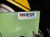 a close up of a green machine with a sign on it