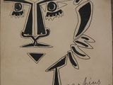 an image of a drawing of a man ' s face on a piece of paper