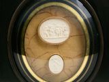 a picture of a picture of a coin and a coin in a picture frame