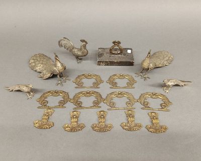 an image of a group of antique silverware items on a table