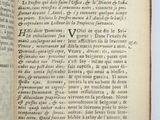 an open book with a black and white image of the title of a poem