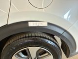 a close up of a car tire with a sticker on it