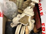 a box full of assorted items that include a clock and other items