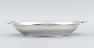 silver plated bowl on a white background with a light gray background