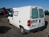 a white van that is parked in a parking lot