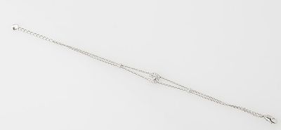 a close up of a silver bracelet with a chain on a white background