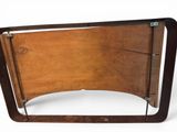 a wooden bed frame with a metal frame on it