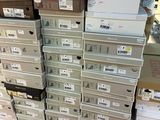 many boxes stacked on top of each other on the floor