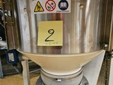 an image of a stainless steel tank with a yellow sticker on it