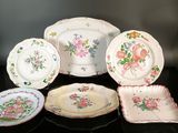 a lot of plates that are sitting on a table