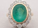 an emerald and diamond ring