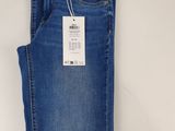the back of a pair of blue jeans on a white background