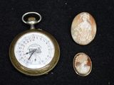 an image of a pocket watch and a pair of cameo cameos