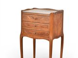 an image of a small wooden table with drawers on it