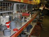 many pots and pans on the shelves in the store