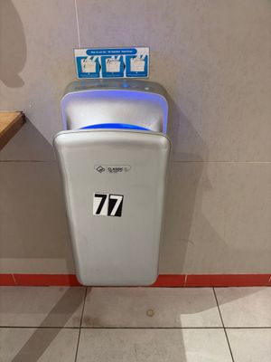a paper towel dispenser in a public restroom
