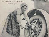 an old advertisement for a car with a woman working on it