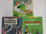 trois livres pour enfants sont posés sur une surface blanche