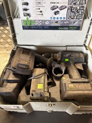 a box full of tools that are sitting on the floor