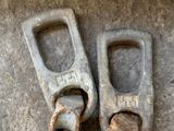 two pieces of metal that have been placed on the ground